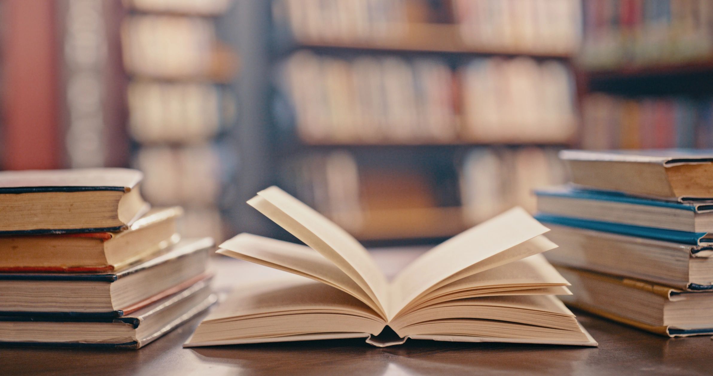 Open book on a table in a library